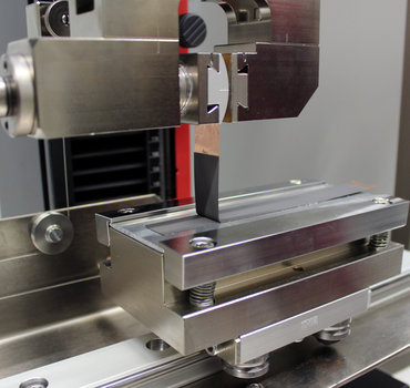 Lithium-ion battery testing: mechanical bond strength between active material and substrate in 90° peel test on arrester foil