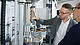 User checks the gripped specimen before the fatigue test in the autoclave