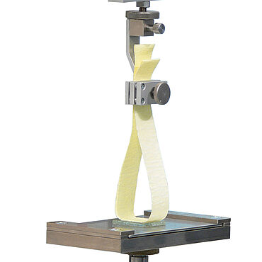 Loop tack test: initial stickiness or application tack of test strips on interchangeable plates, e.g., according to the Finat test method no. 9