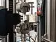 A laser extensometer with a short furnace enables strain measurement on flat specimens up to +1,400°C, which are gripped outside the furnace.