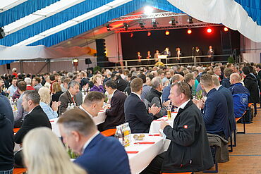 Exhibition visitors in the festivities tent