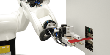 Automated cross-section measurement of a plastic specimen