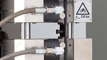 ASTM D6641, AITM1-0008: Combined loading compression test with ZwickRoell HCCF and strain gauges applied on both sides for strain measurement