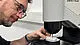Close-up of a plastic hardness test according to ASTM D785 & ISO 2039-1/-2 using a Rockwell hardness tester from ZwickRoell