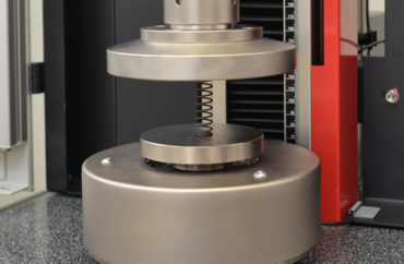 Force measuring system with load bypass unit