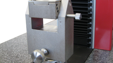 Needle puncture test fixture with variable test angle