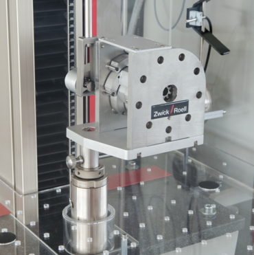 Radial compression test fixture for tests on stent grafts, IVC filters and artificial heart valves