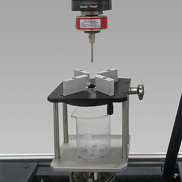 Test fixture for performing autoinjector spring simulation