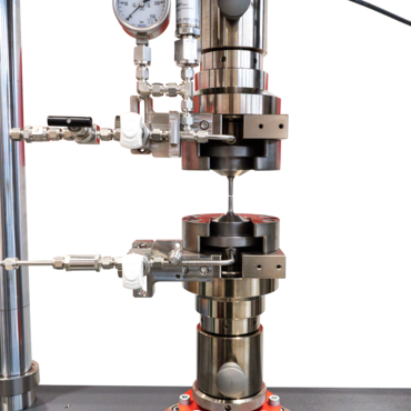 Secção de uma máquina para ensaios de fluência com amostra oca com enchimento de hidrogênio